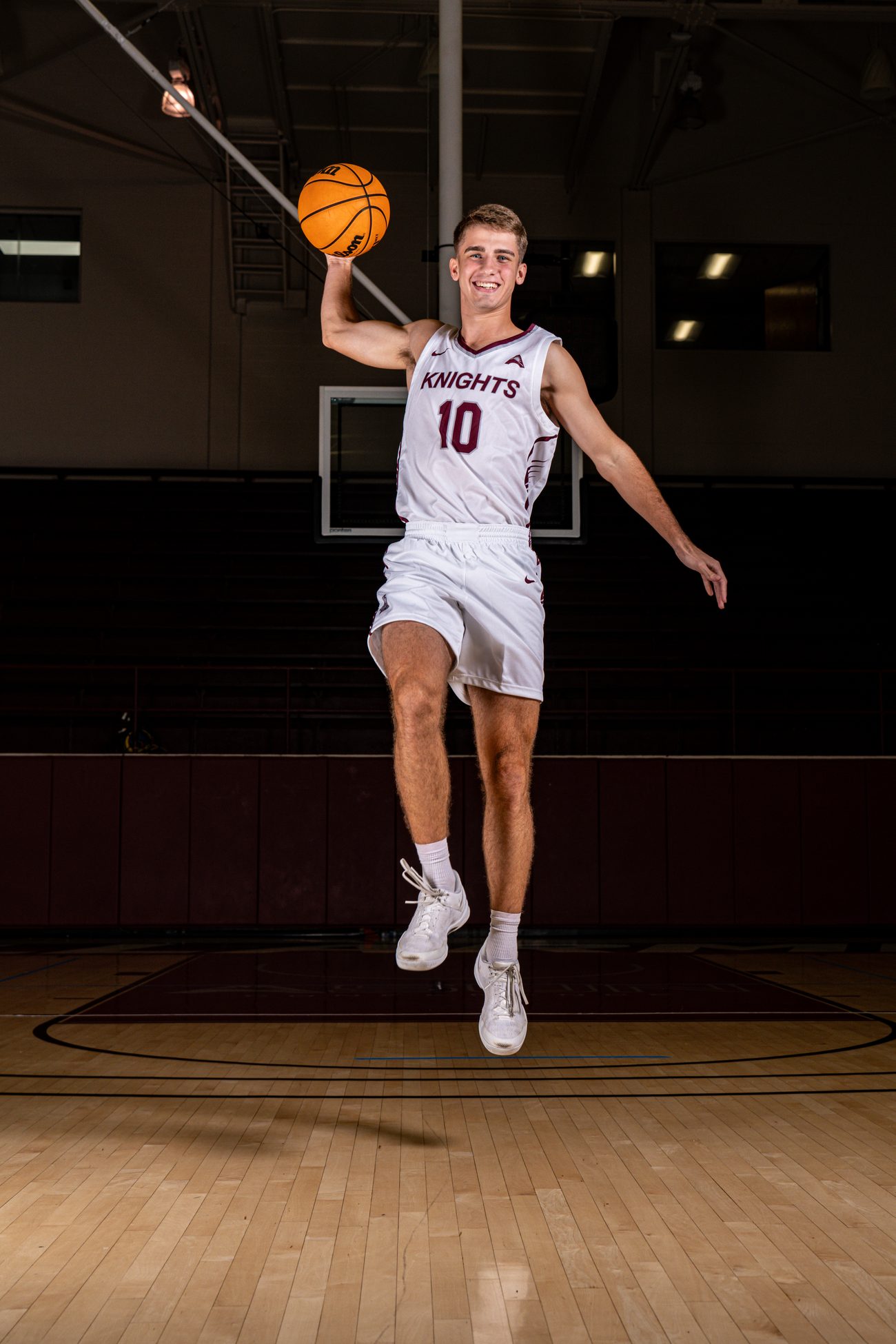 Bellarmine basketball player leaping with the ball